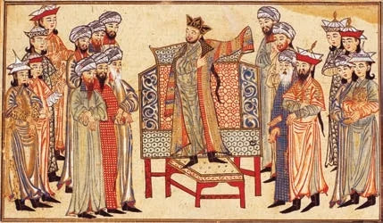 Gazneli hükümdarı Sultan Mahmud hil’at giyerken
